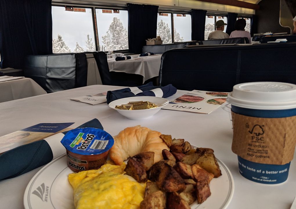 A late morning breakfast in the dining car afforded a solo dining experience with snowy mountain views, though the omelet and potatoes were underwhelming. (Crystal Paul / The Seattle Times)