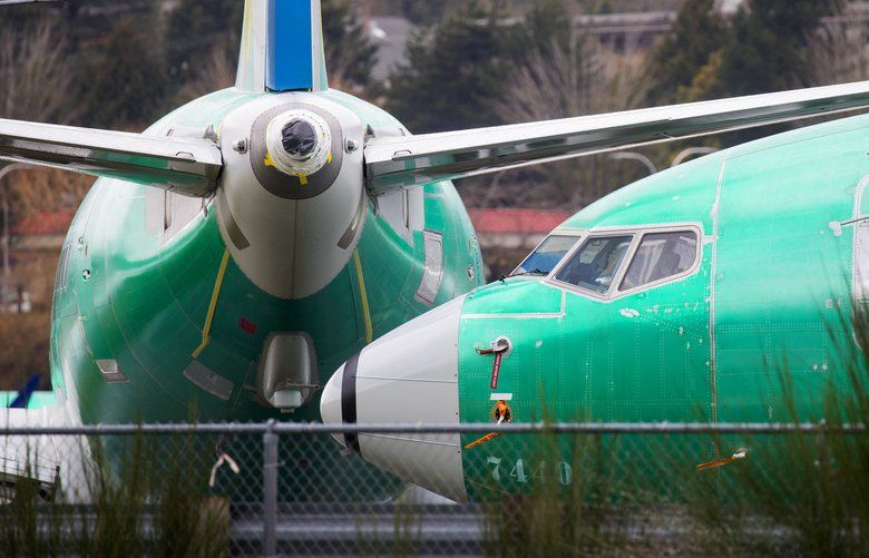 Boeing 737 Max 8’s sit along the runway outside the 737 factory in Renton at Renton Municipal Airport. The AOA instrument is the lower of the two pieces of equipment near the nose of the plane. 

Photographed on March 13, 2019 209611