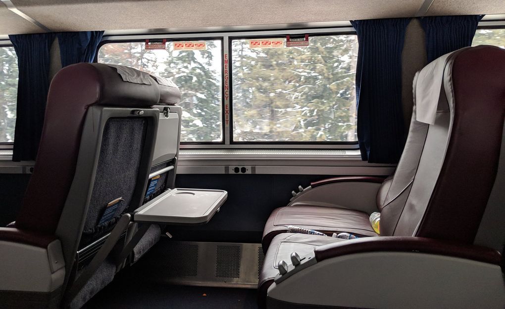 Business class seats like this one on the Coast Starlight train are usually about $89 and include two bottles of water and Internet access. Though, the internet was not working the day this reporter rode on the train. (Crystal Paul / The Seattle Times)