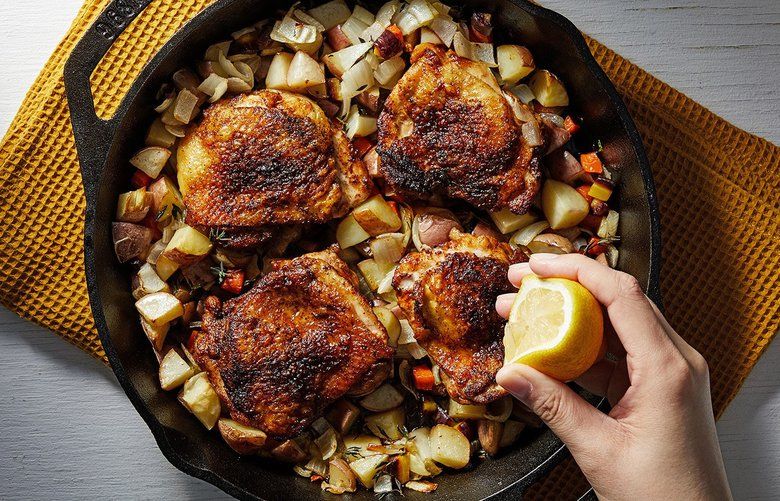 Skillet-Roasted Chicken Thighs With Potato-Carrot Hash. MUST CREDIT: Photo by Tom McCorkle for The Washington Post; food styling by The Washington Post’s Bonnie S. Benwick.