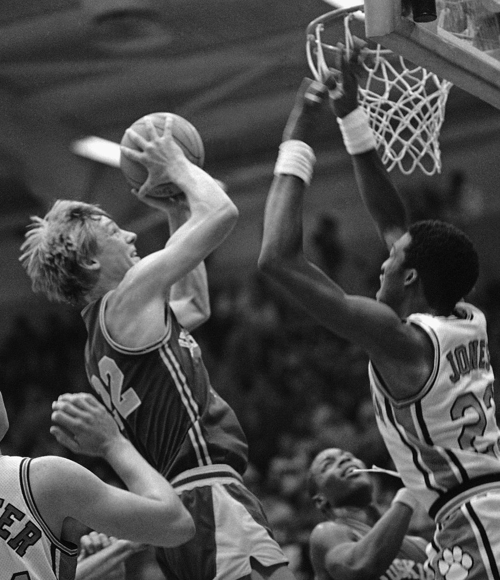University of Washington’s Detlef Schrempf, 22, puts up a shot between Clemson’s David Shaffer and Raymond Jones in the Alaska Shootout game in Anchorage, Alaska, Nov. 29, 1982. Washington won 76-66. (Barry Sweet / AP)