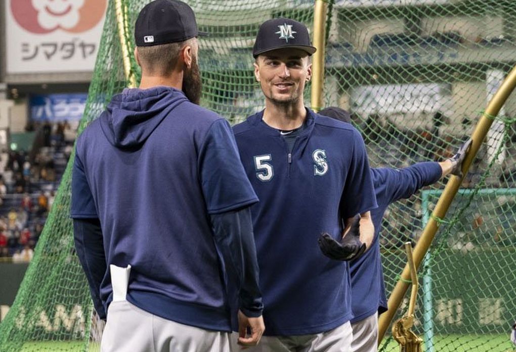 Braden Bishop, center, takes his cuts in the batting cage March 17 in Tokyo. (Dean Rutz / The Seattle Times)