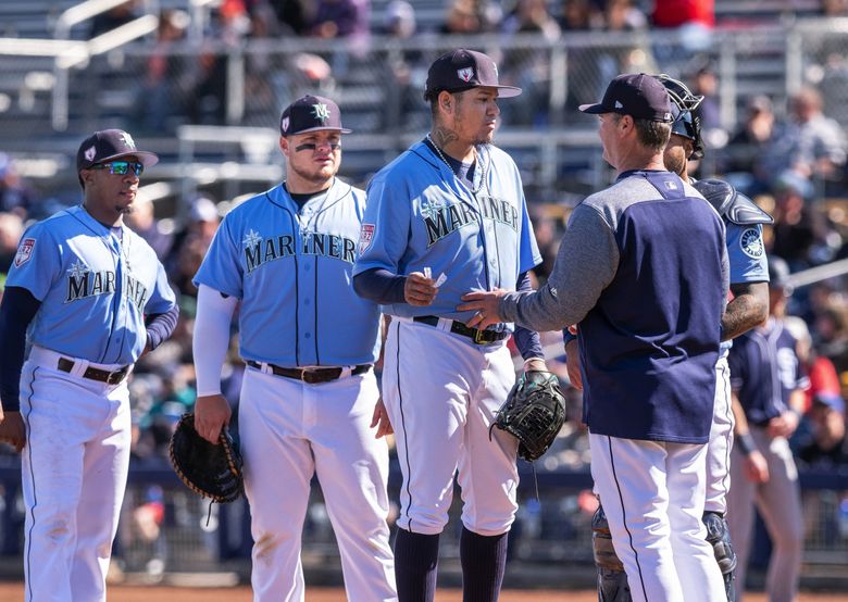 Seattle Mariners' Felix Hernandez walks to the dugout after the