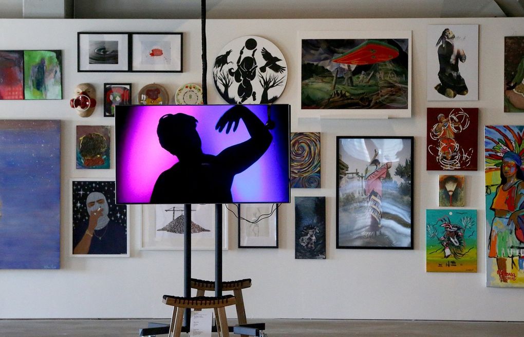 All styles of art work —including Chai Adera’s video “Earth Prayer” — are on display in “yəhaw̓,” the inaugural exhibition at ARTS at King Street Station. The exhibition features work by more than 200 indigenous artists. (Greg Gilbert / The Seattle Times)