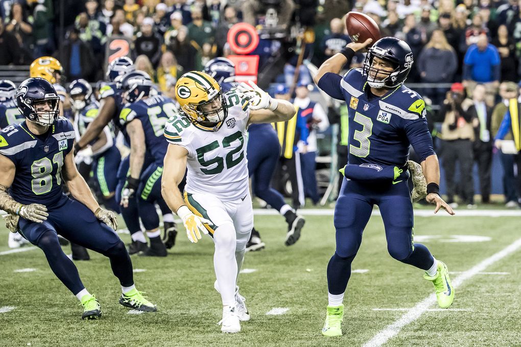 Seattle Seahawks quarterback Russell Wilson (3) throws an incomplete pass under pressure from the Green Bay Packers linebacker Clay Matthews at CenturyLink Field in Seattle on November 15, 2018. (Bettina Hansen / The Seattle Times)