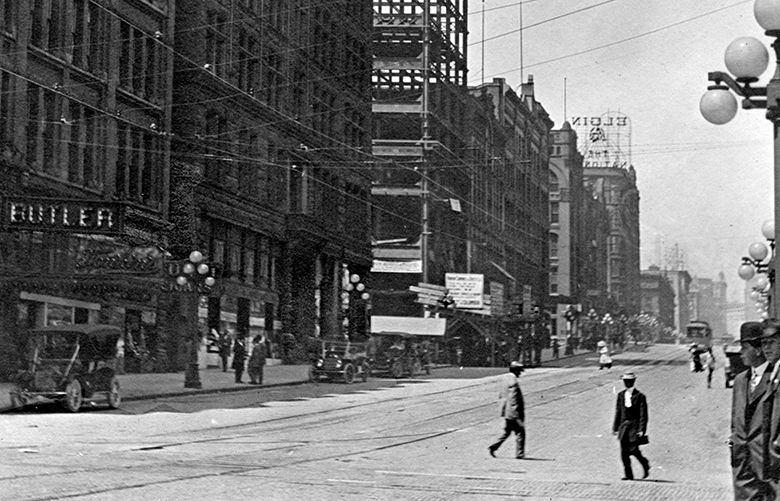 Then caption:  Looking north on Second Avenue thru its intersection with James Street in circa 1911, the year the Hoge Building’s steel frame at the northwest corner of James Street and Second Avenue was completed.