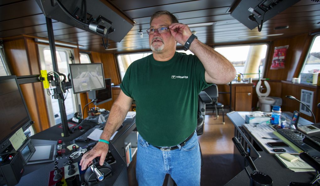 Captain Jim Fletcher guides the towboat Granite Point up and down the Snake River near Clarkston, a job his father, Scotty, did for 50 years before him. (Mike Siegel / The Seattle Times)