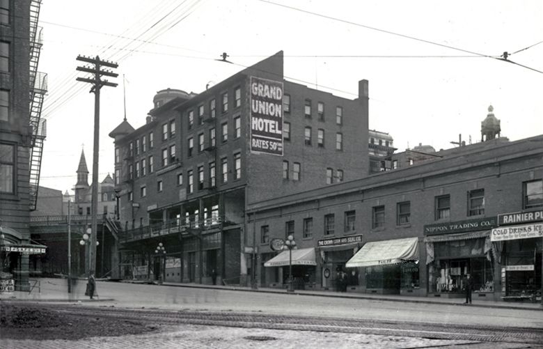 THEN CAPTION:  The hillside of the International District looking northeast from Fourth Avenue and Washington Street.