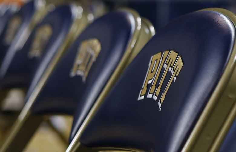 The University of Pittsburgh is offering graduating seniors up to $5,000 in federal student loan relief with one request: They pay it forward. (AP file photo by Keith Srakocic)