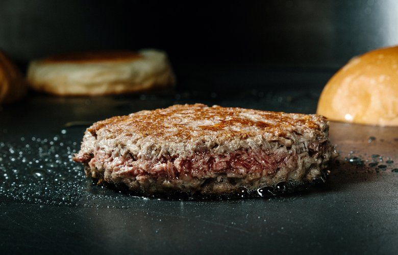 FILE — An Impossible Foods meatless burger on the grill at the company’s headquarters in Redwood City, Calif., on Dec. 23, 2016. Burger King is introducing a version of its iconic Whopper sandwich filled with a vegetarian patty from the California-based startup. (Jason Henry/The New York Times) XNYTF