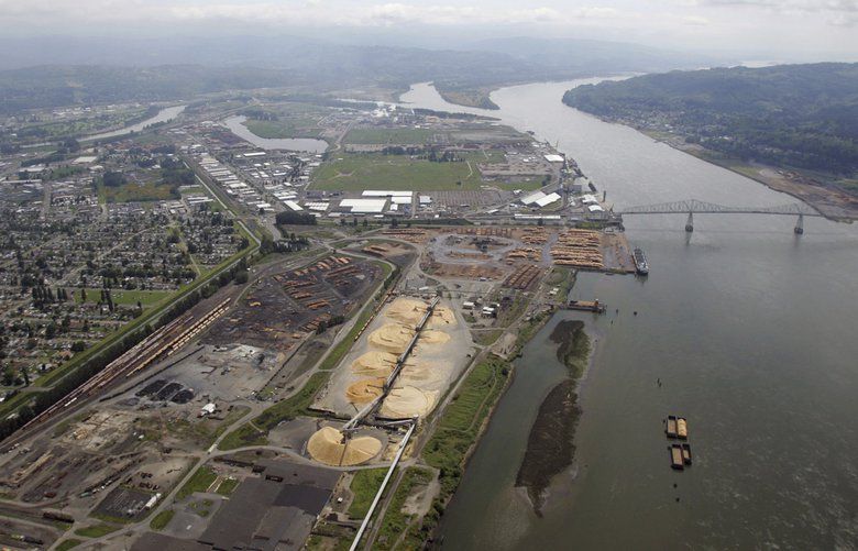 FILE- This May 12, 2005, file photo, shows the port of Longview on the Columbia River at Longview, Wash. A judge says Washington state’s Department of Natural Resources acted arbitrarily when it blocked a sublease sought by developers of a proposed coal-export terminal near Longview. (AP Photo/Elaine Thompson, File) PDX517 PDX517