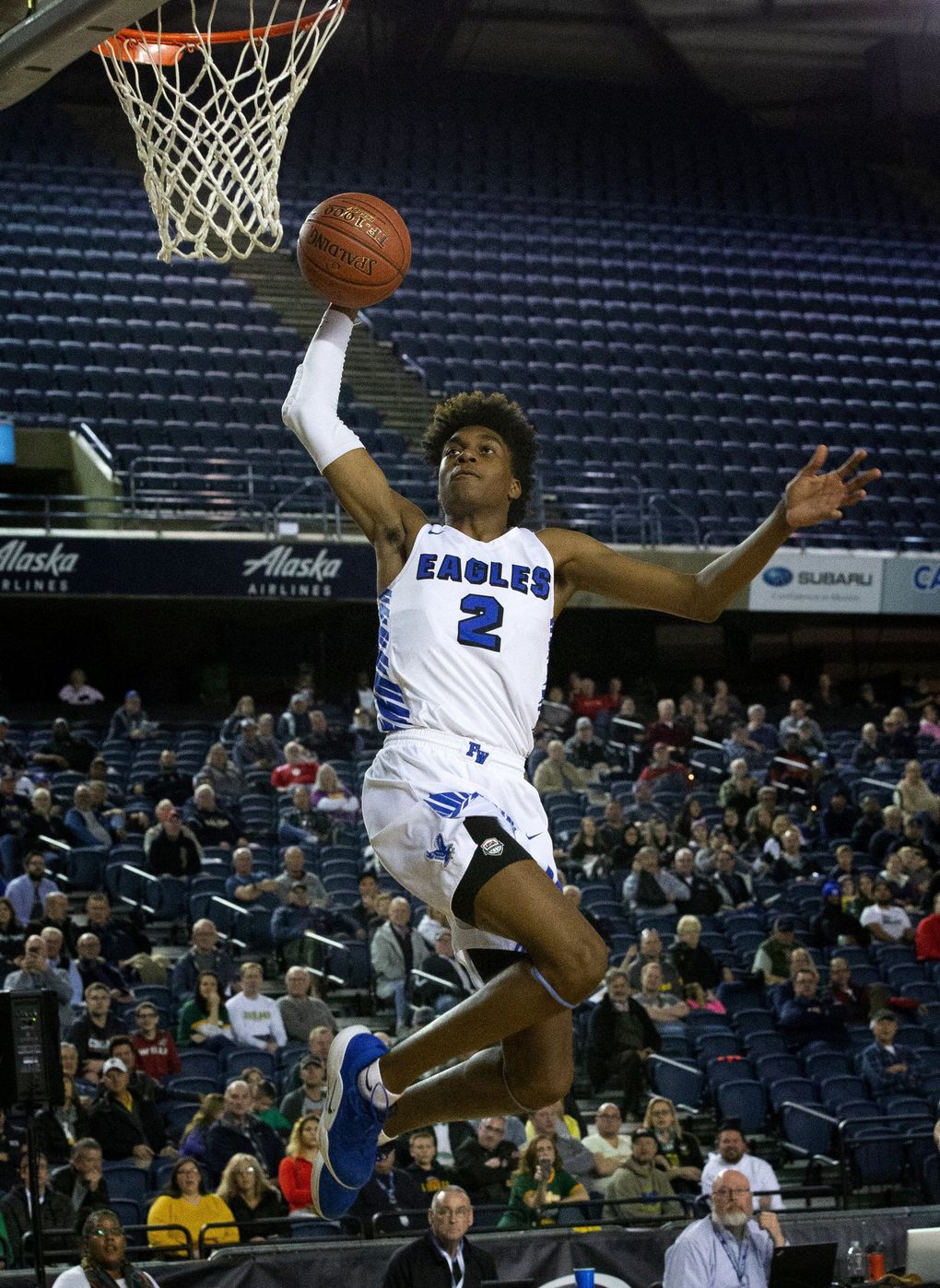 Jaden McDaniels, #2, with Federal Way Eagles boys basketball team breaks away for a dunk against the Richland Bombers in the 2019 state quarterfinals at the Tacoma Dome. (Ellen M. Banner / The Seattle Times)