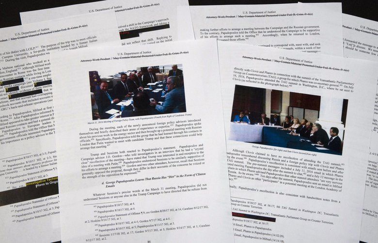 Special counsel Robert Mueller’s redacted report on the investigation into Russian interference in the 2016 presidential election is photographed Thursday, April 18, 2019, in Washington. The photos in the report show George Papadopoulos and others in meetings. (AP Photo/Jon Elswick) DCJE132 DCJE132