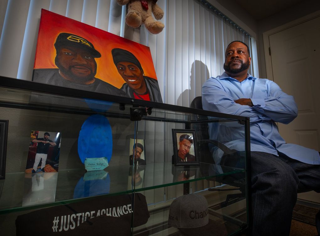 Frank Gittens keeps a memorial to his son, Chance, in his Renton home. The portrait was painted from a photo taken two months before Chance was killed. The blue handprint on the shelf below was taken in the hospital just before Chance died. (Ellen M. Banner / The Seattle Times)