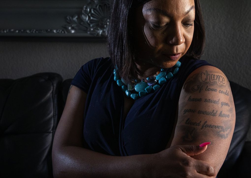 Alexis Dunlap and her family had been packing to move to Federal Way the day her son, Chance, was fatally shot outside their apartment by King County sheriff’s deputies. Dunlap, a Metro bus driver, has a tattoo dedicated to him. (Ellen M. Banner / The Seattle Times)