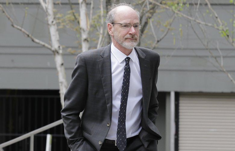Craig Lorch, right, one of the owners of electronics recycler Total Reclaim Inc., which is based in the Seattle suburb of Kent, Wash., walks towards a federal courthouse with attorneys John Wolfe, left, and Rebecca Gorn, center, Tuesday, April 23, 2019, in Seattle. Lorch and co-owner Jeff Zirkle were sentenced to 28 months in prison Tuesday for what prosecutors described as the largest known fraud of its type in the nation: a seven-year scheme to ship dangerous waste to Hong Kong, rather than safely handling it in the U.S. as promised. (AP Photo/Ted S. Warren) WATW102 WATW102