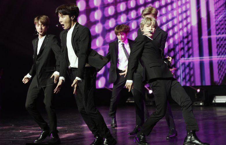 South Korean pop group BTS performs during a Korean cultural event in Paris, France, Sunday, Oct. 14, 2018. South Korean President Moon Jae-in is for a 3-days visit in France. (Yoan Valat/Pool Photo via AP) OTK103