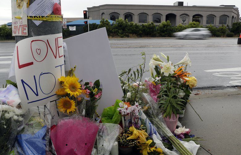 Signs of support and flowers adorn a post in front of the Chabad of Poway synagogue, Monday, April 29, 2019, in Poway, Calif. A man opened fire Saturday, April 27 inside the synagogue near San Diego, as worshippers celebrated the last day of a major Jewish holiday. (AP Photo/Gregory Bull) CAGB102 CAGB102