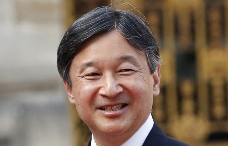 FILE – In this Sept. 12, 2018, file photo, Japan’s Crown Prince Naruhito is greeted by French President Emmanuel Macron before a meeting at the Chateau de Versailles, west of Paris. Japanâ€™s Emperor Akihito, abdicating Tuesday, April 30, 2019, has a relatively small family, and it will shrink in coming years. (AP Photo/Christophe Ena, File) TKMY402 TKMY402