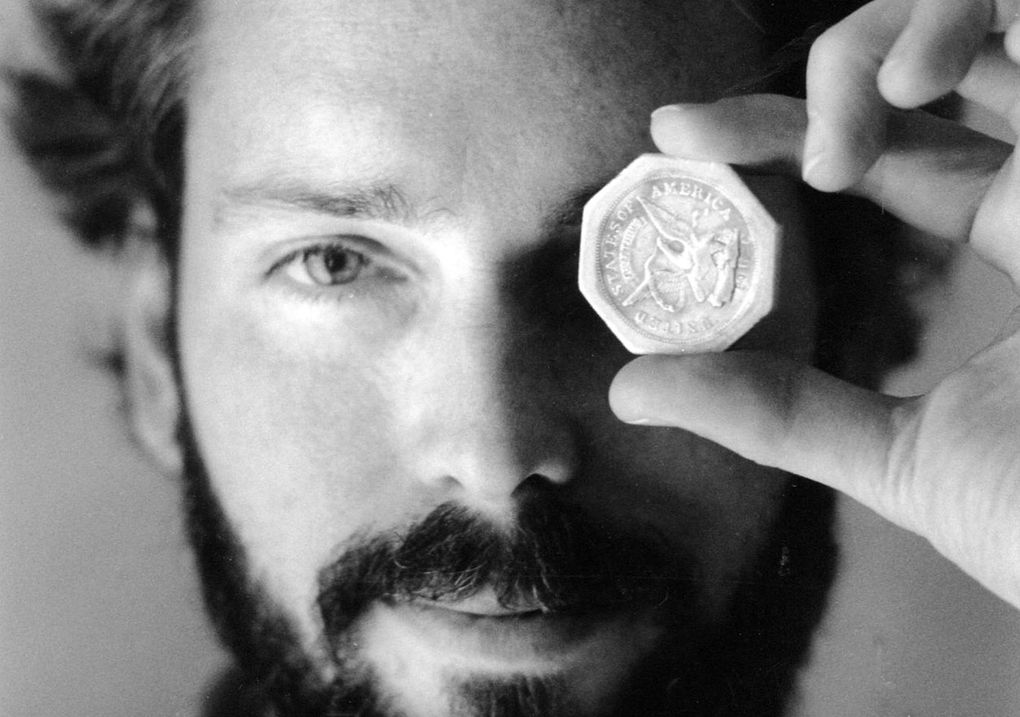 In this November 1989 photo, treasure hunter Tommy Thompson is shown holding a $50 pioneer gold piece retrieved from the wreck of the sunken ship Central America. (Lon Horwedel / The Columbus Dispatch)
