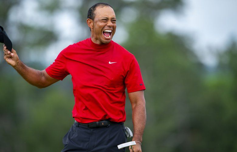 Tiger Woods reacts on the 18th hole after winning the Masters in Augusta, Ga., April 14, 2019. He captured his fifth Masters title and his 15th major tournament on Sunday, snapping a championship drought of nearly 11 years. (Doug Mills/The New York Times) XNYT58 XNYT58