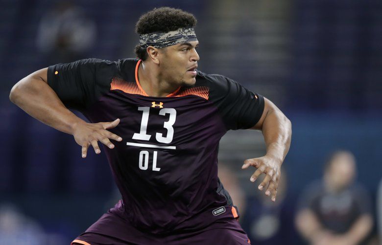 FILE – In this March 1, 2019, file photo, Washington State offensive lineman Andre Dillard runs a drill at the NFL football scouting combine in Indianapolis. Dillard is a possible pick in the 2019 NFL Draft. (AP Photo/Michael Conroy, File) NYPK245 NYPK245