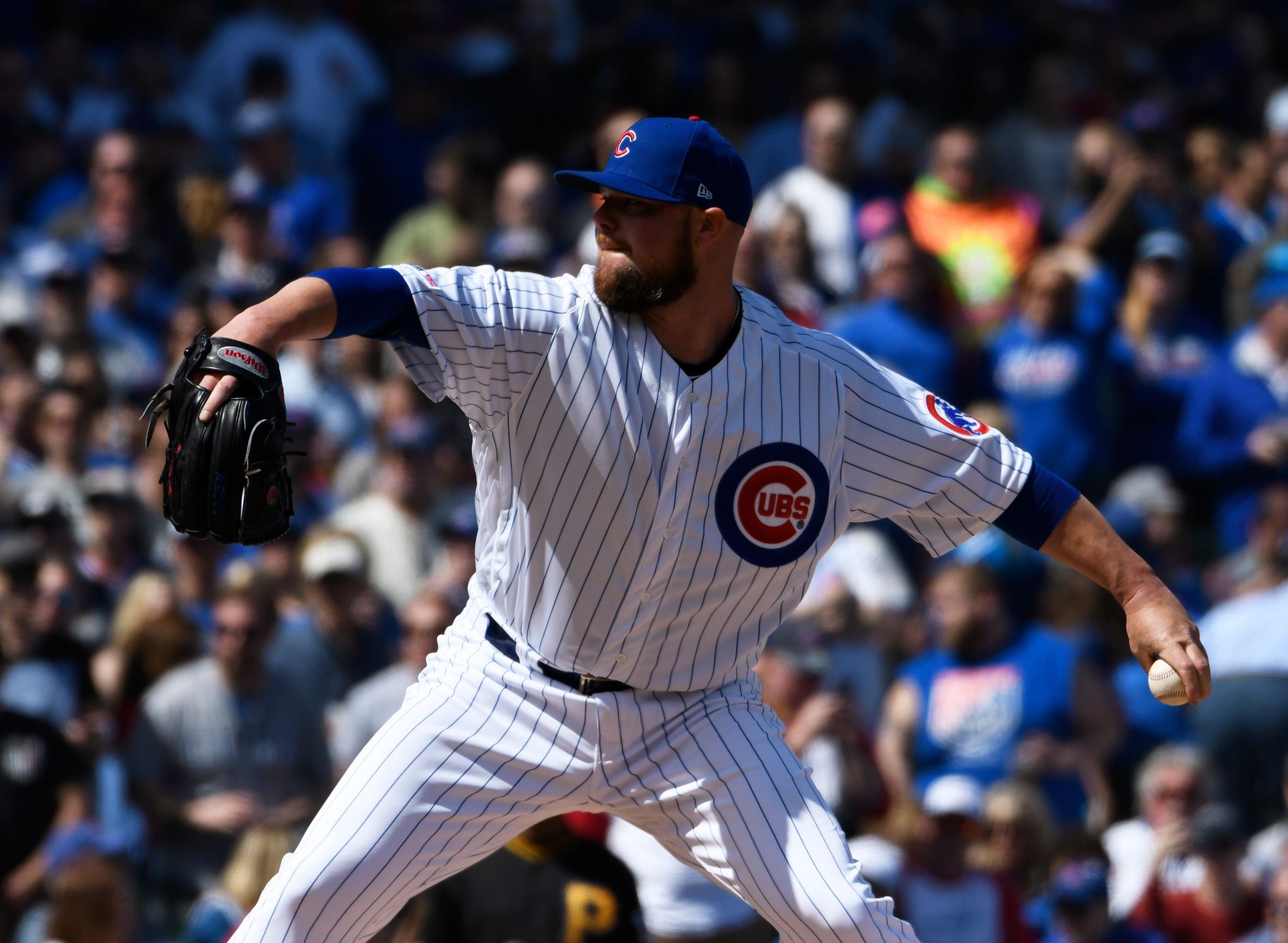 Cubs pitcher Jon Lester is still throwing his entire glove to