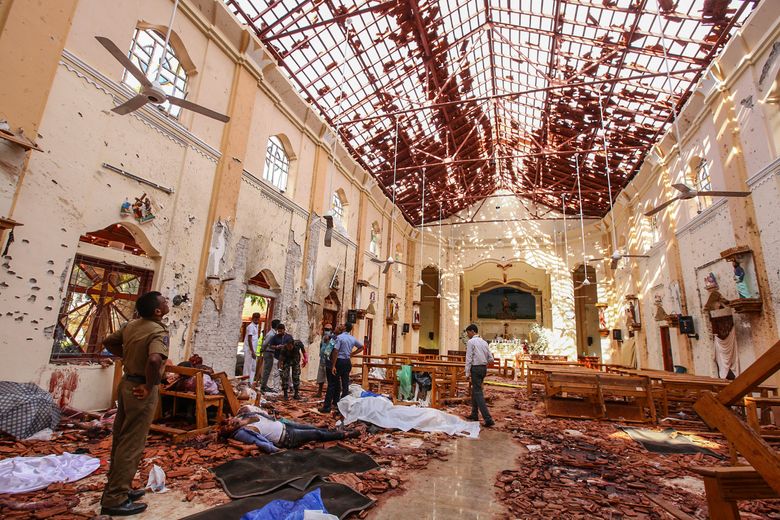 Dead bodies of victims lie inside St. Sebastian’s Church damaged in blast in Negombo, north of Colombo, Sri Lanka, Sunday, April 21, 2019.  More than hundred were killed and hundreds more hospitalized with injuries from eight blasts that rocked churches and hotels in and just outside of Sri Lanka’s capital on Easter Sunday, officials said, the worst violence to hit the South Asian country since its civil war ended a decade ago. (AP Photo/Chamila Karunarathne)