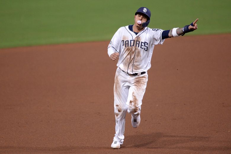 Manny Machado of the San Diego Padres rounds the bases after