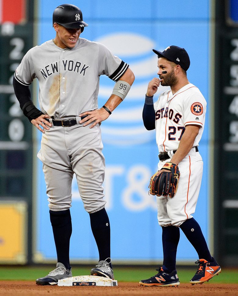 Jose Altuve had a little help posing for a picture next to Aaron Judge