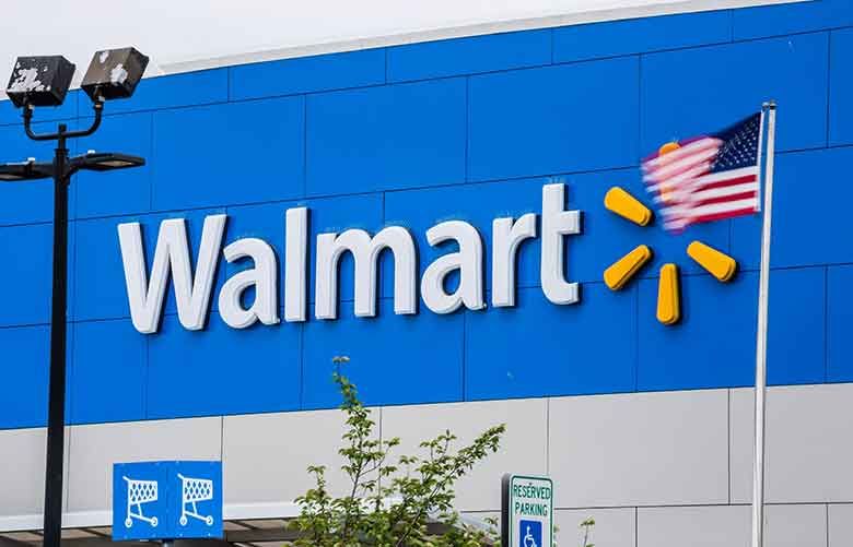 An American flag flies outside of a Walmart Inc. store in Secaucus, New Jersey. (Bloomberg photo by Timothy Fadek)