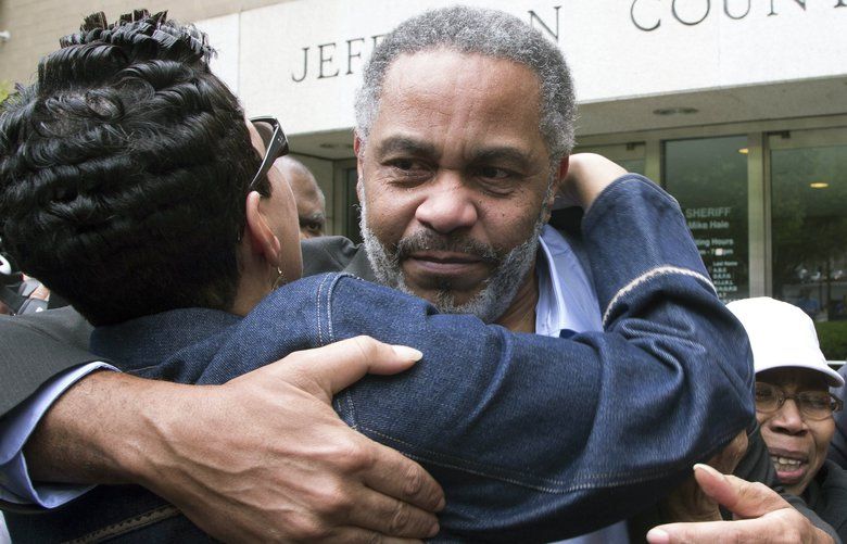 FILE – In this April 3, 2015, file photo, Pat Turner, left, hugs Anthony Ray Hinton as he leaves the Jefferson County jail in Birmingham, Ala. Hinton spent nearly 30 years on Alabama’s death row. Hinton was freed after new ballistics tests contradicted the sole evidence used convict him of two Birmingham murders. With executions still on hold because of a shortage of drugs needed for lethal injections, three prisoners once sentenced to death — Anthony Ray Hinton, William Ziegler and Montez Spradley — were released from prison after claiming they were wrongly convicted, becoming one of Alabama’s top news stories in 2015. (AP Photo/Hal Yeager, File) AX602