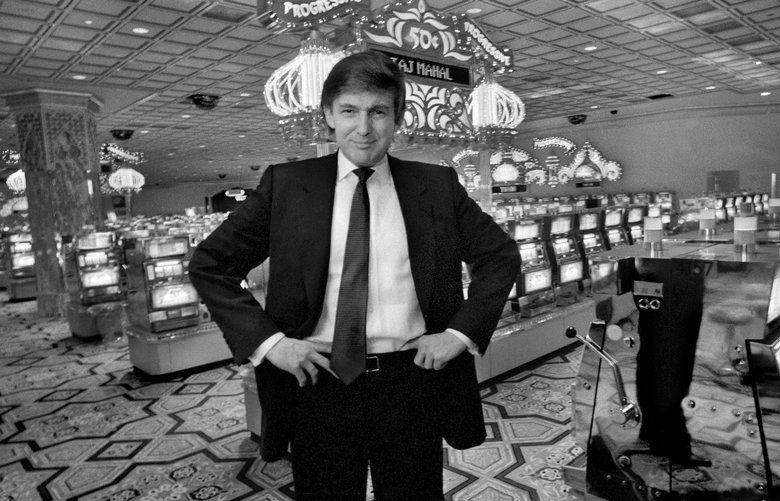 FILE — Donald Trump stands in a slots parlor at hisTrump Taj Mahal casino in Atlantic City, N.J., March 16, 1990. Printouts obtained by The New York Times from Trump’s official Internal Revenue Service tax transcripts, including figures from his federal tax form for the years 1985 to 1994, reveal that Trump’s businesses were in far bleaker condition at that time than was previously known. (Angel Franco/The New York Times) XNYT283
