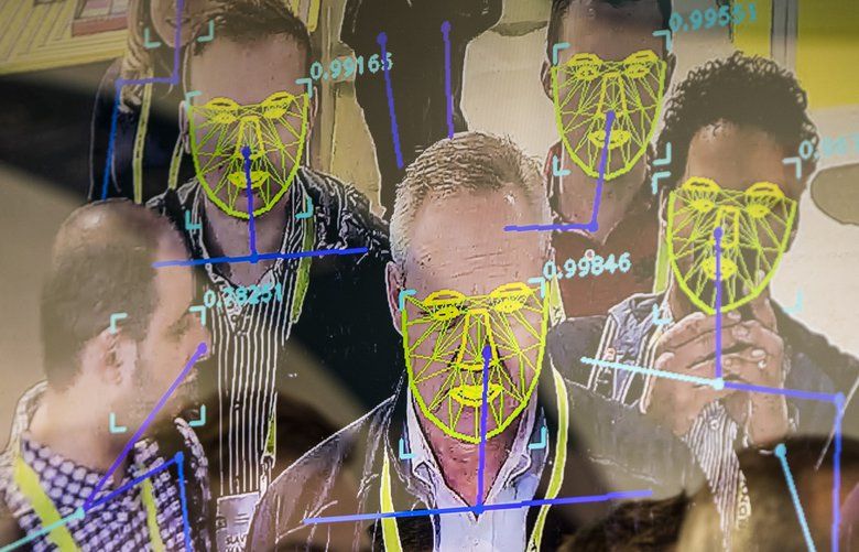 FILE — Attendees interact with a facial recognition demonstration during the Consumer Electronics Show in Las Vegas, Jan. 8, 2019. The San Francisco board of supervisors has enacted the first ban by a major American city on the use of facial recognition technology by police and other municipal agencies. (Joe Buglewicz/The New York Times) 