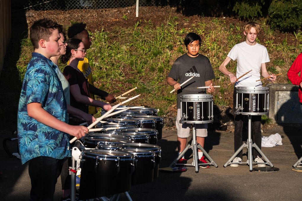 Tony Sodano’s drum line, part of JazzED, rehearses in the parking lot of the former Martin Luther King Elementary School. From left: Conner Carr, Julianne Carroll, Isabel Russak, Jaelin Heyman, Paul Nguyen and Olaf Morrison. (Dean Rutz / The Seattle Times)