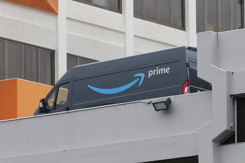 Amazon pledged to make reductions in greenhouse gas emissions as part of its “Shipment Zero” program, but has also procured a new fleet of diesel delivery vans like this one. Amazon shareholders vote Wednesday on whether to report publicly on the company’s climate risks and fossil fuel reduction plans. (Ellen M. Banner / The Seattle Times)