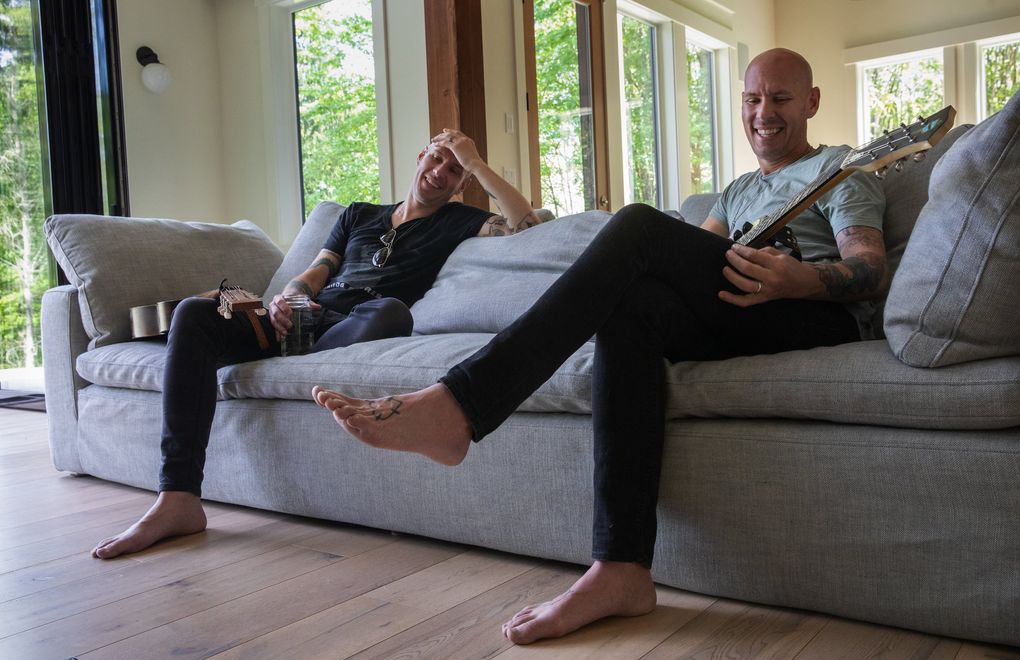 Tim, left, and Phil Hanseroth, Brandi Carlile’s longtime bandmates and songwriting partners, hang out in Phil’s Maple Valley home. (Ellen M. Banner / The Seattle Times)