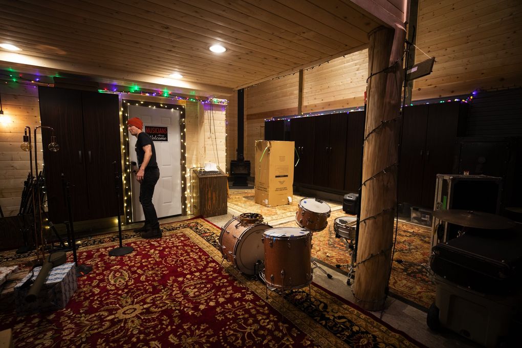 Tim Hanseroth heads from one studio, where the band practices and sometimes records, to another studio upstairs. (Ellen M. Banner / The Seattle Times)