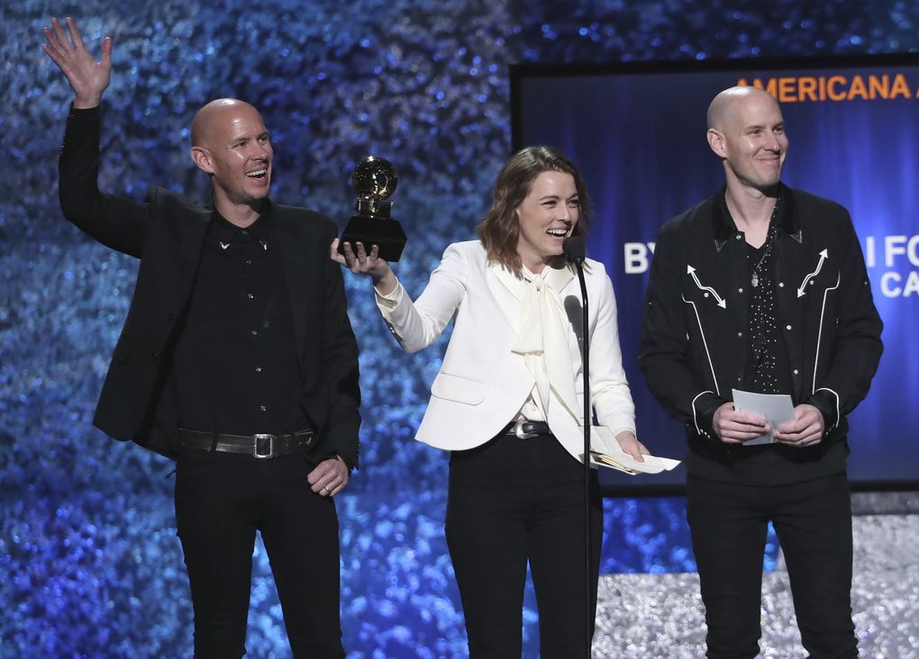Phil Hanseroth, left, Brandi Carlile and Tim Hanseroth accept the award for best Americana album for “By the Way, I Forgive You” at the 61st annual Grammy Awards on Feb. 10. (Matt Sayles / Invision / The Associated Press)