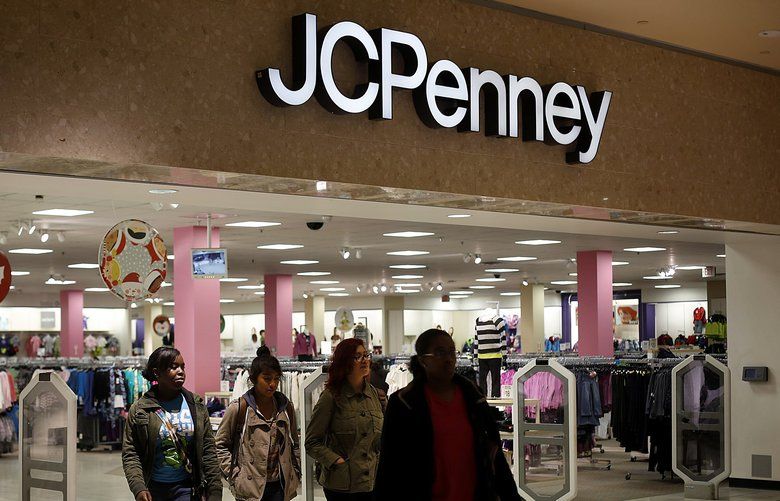 Shoppers exit a J.C. Penney Co. department store at the Queens Center Mall in the Queens borough of New York, U.S., on Friday, Nov. 9, 2012.. Photographer: Victor J. Blue/Bloomberg