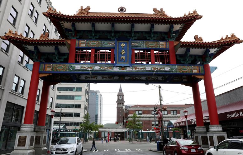 A look through the Historic Chinatown Gate shows the International District/Chinatown Link Lightrail Station, Thursday, May 16, 2019 in Seattle. Residents and leaders are ambivalent or undecided about how to add a second subway station and tunnel here for ST3, but the gate could be incorporated into future plans.  (Ken Lambert / The Seattle Times)