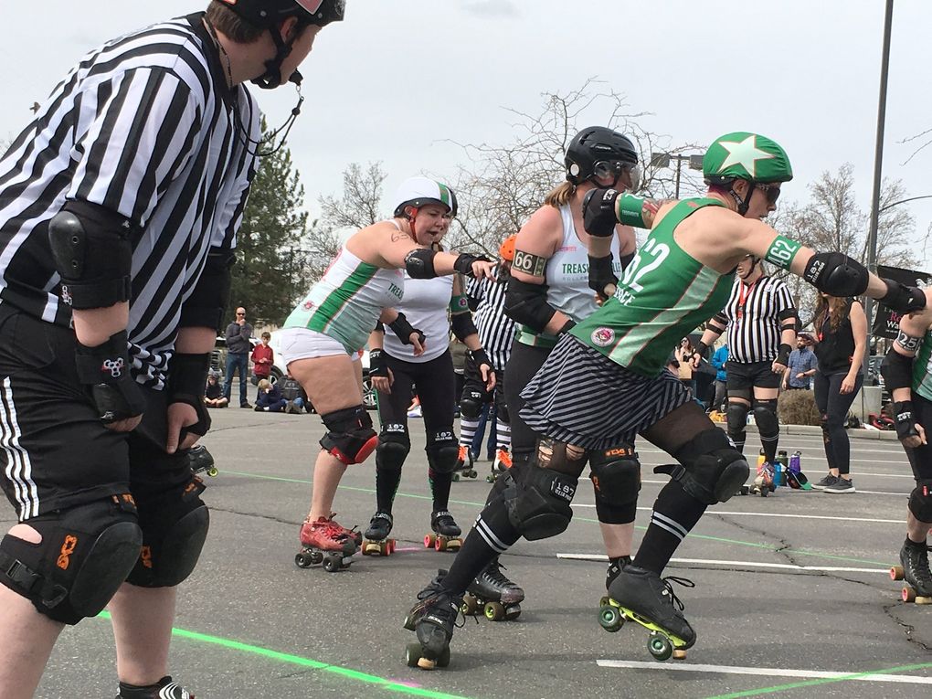 At Boise’s Treefort Music Fest this year, the Treasure Valley Roller Girls, founded in 2006 and a member of the international Women’s Flat Track Derby Association, compete in a parking lot. (Brendan Kiley / The Seattle Times)