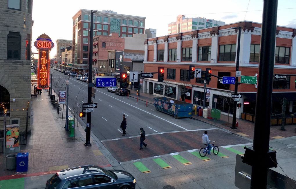 Downtown Boise still looks modest, but its population and cultural scene are booming. “I moved here 15 years ago, to a sleepy little outpost,” said Ryan Peck, who came to teach biology at Boise State University and now runs Boise Rock School. “In a couple of years, it just took off.” (Brendan Kiley / The Seattle Times)