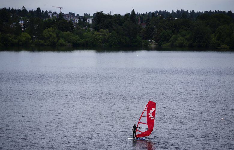 A windsurfer at Green Lake catches a gentle breeze, Sunday, May 26, 2019 in Seattle. 210388