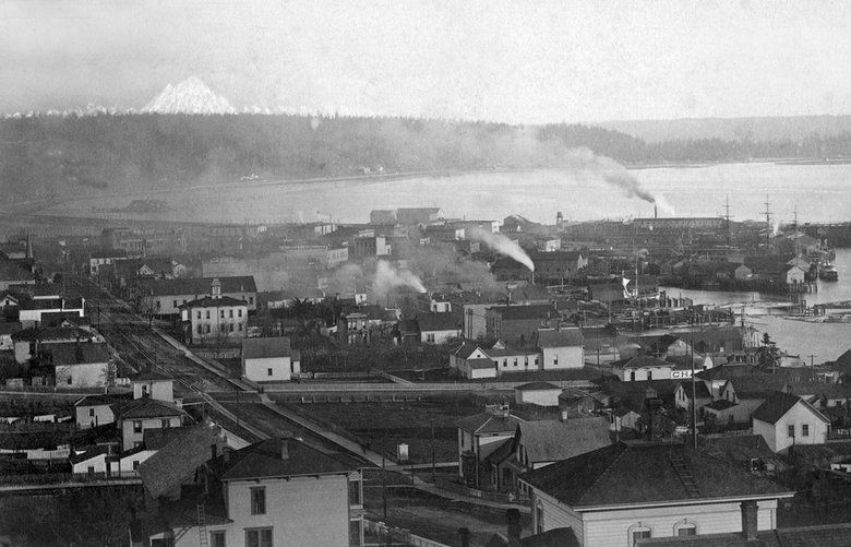 This 1885 or 1886 view shows only the right (west) half of a panorama that is wide enough to support two hand-drawn Mount Rainiers. You can find the full panorama, with both peaks for your confusion and/or pleasure, at seattletimes.com/pacificnw.