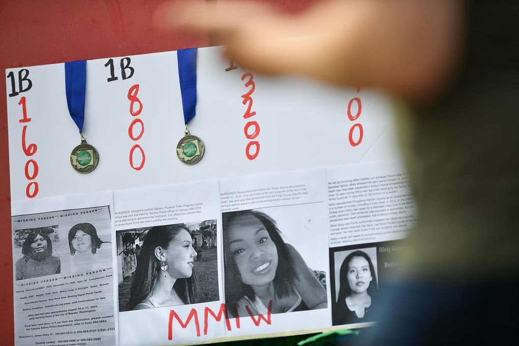 Rosalie Fish draped her running medals on a poster she made honoring Missing and Murdered Indigenous Women during the state track and field meet on May 25 in Cheney. (Tyler Tjomsland / The Spokesman-Review)