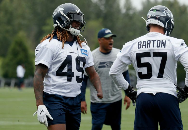 Cody Barton of the Seattle Seahawks looks on during the game