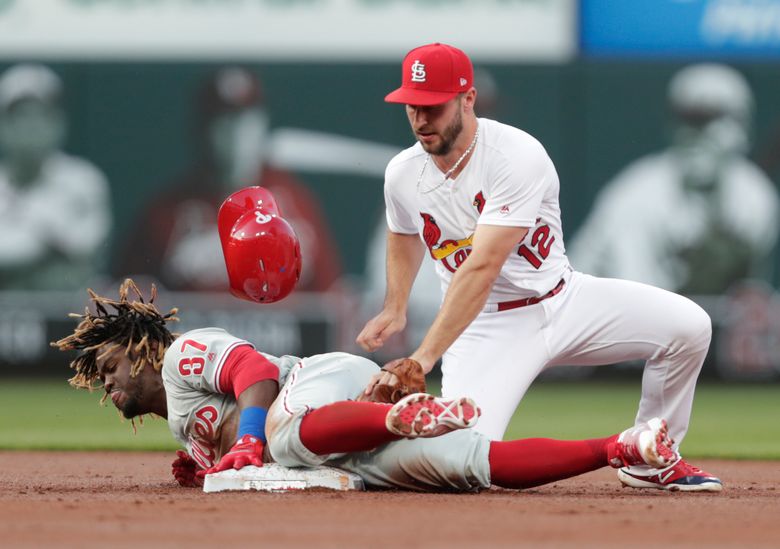 Philadelphia Phillies' Bryce Harper, right, watches his grand slam