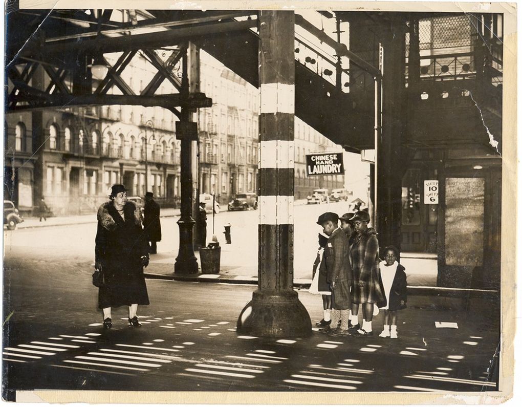 One of many original photos by Weegee that David Young found. The caption reads: “Woman and children under the el in Harlem, 135th st. and 8th Ave. April, 1937.” (Copyright Weegee / International Center of Photography)