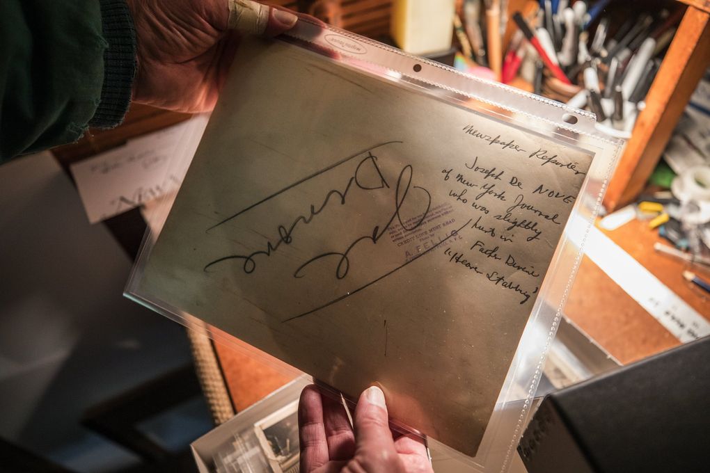 This flip side of an original Weegee print shows the photo subject’s ID in big letters, along with a caption explaining what the photo was about. The credit stamp says “A. Fellig.” (Steve Ringman / The Seattle Times)